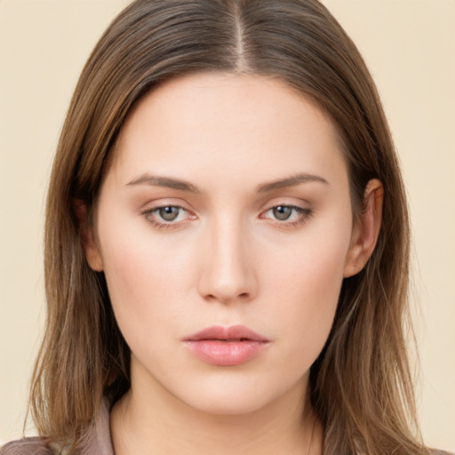 Neutral white young-adult female with long  brown hair and brown eyes