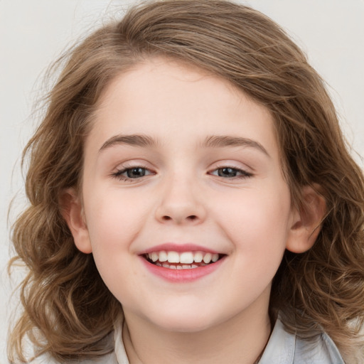 Joyful white child female with medium  brown hair and brown eyes