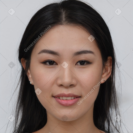 Joyful asian young-adult female with long  brown hair and brown eyes