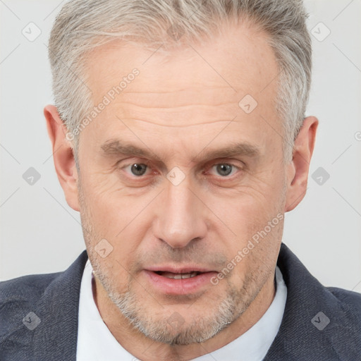 Neutral white middle-aged male with short  gray hair and brown eyes