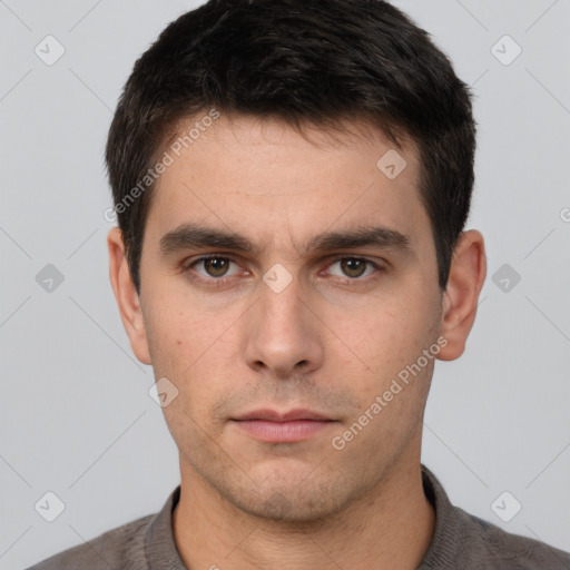 Neutral white young-adult male with short  brown hair and brown eyes