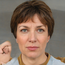 Joyful white adult female with short  brown hair and brown eyes