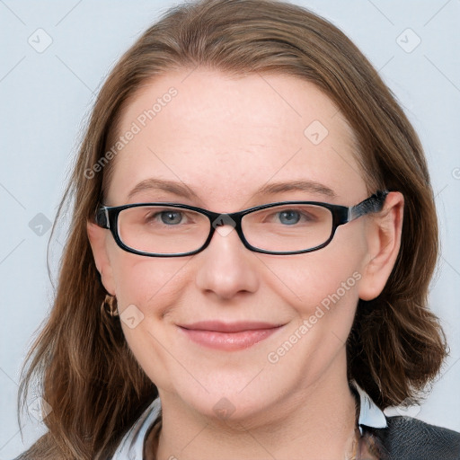 Joyful white young-adult female with medium  brown hair and blue eyes