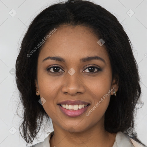 Joyful black young-adult female with medium  brown hair and brown eyes