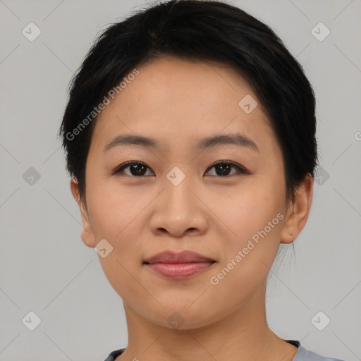 Joyful asian young-adult female with short  brown hair and brown eyes