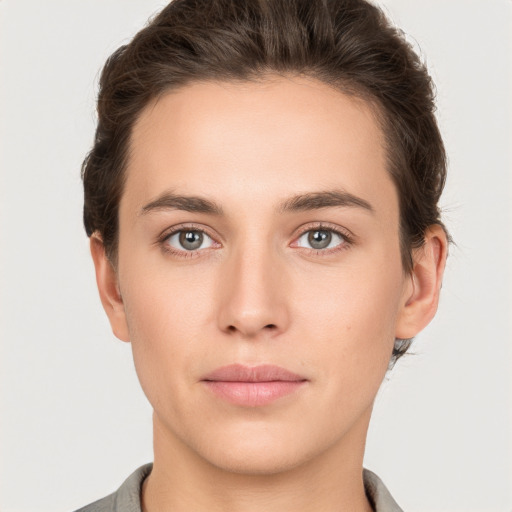 Neutral white young-adult female with short  brown hair and brown eyes