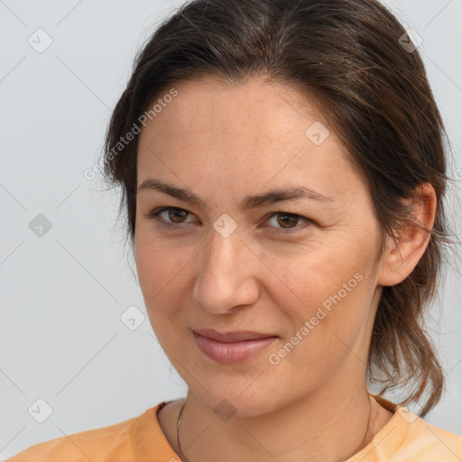 Joyful white adult female with medium  brown hair and brown eyes