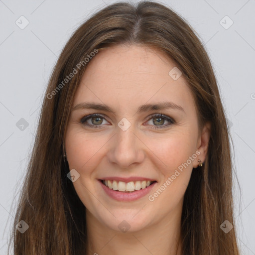 Joyful white young-adult female with long  brown hair and grey eyes