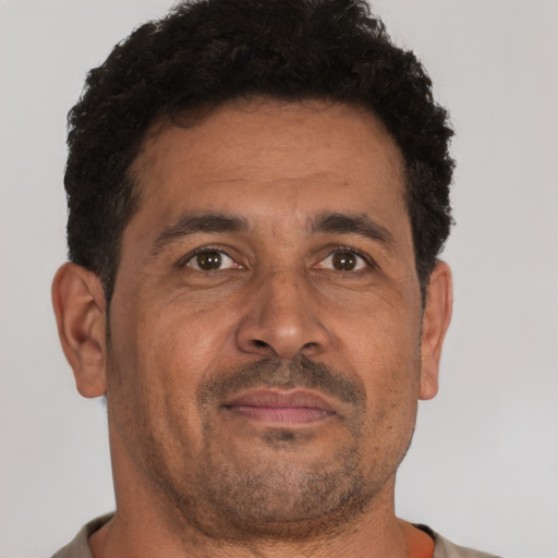 Neutral black adult male with short  brown hair and brown eyes