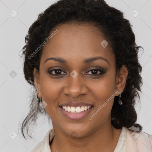 Joyful black young-adult female with long  brown hair and brown eyes