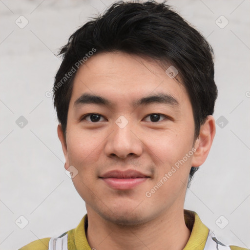 Joyful asian young-adult male with short  brown hair and brown eyes