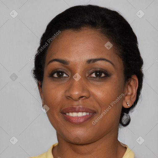 Joyful black young-adult female with short  brown hair and brown eyes