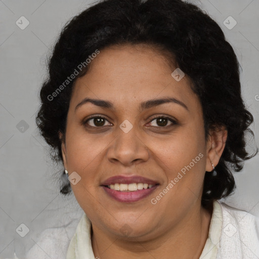 Joyful latino adult female with medium  brown hair and brown eyes