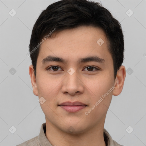 Joyful white young-adult male with short  black hair and brown eyes