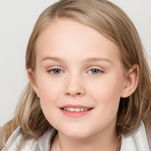 Joyful white child female with medium  brown hair and blue eyes