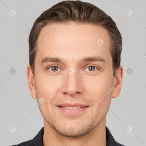 Joyful white young-adult male with short  brown hair and grey eyes