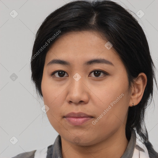 Joyful asian young-adult female with medium  black hair and brown eyes