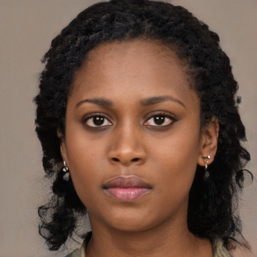 Neutral black young-adult female with long  black hair and brown eyes