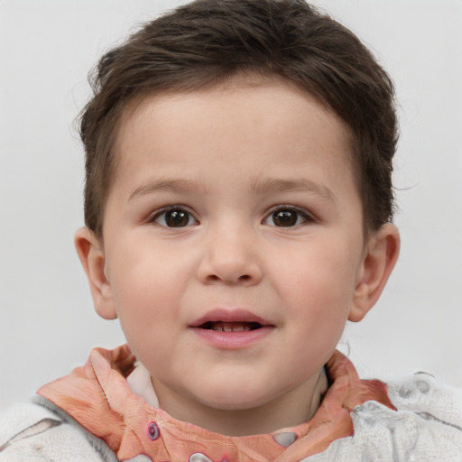 Joyful white child male with short  brown hair and brown eyes