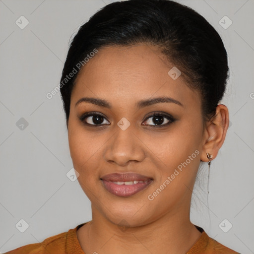 Joyful latino young-adult female with medium  brown hair and brown eyes