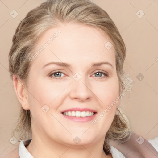 Joyful white adult female with medium  brown hair and blue eyes