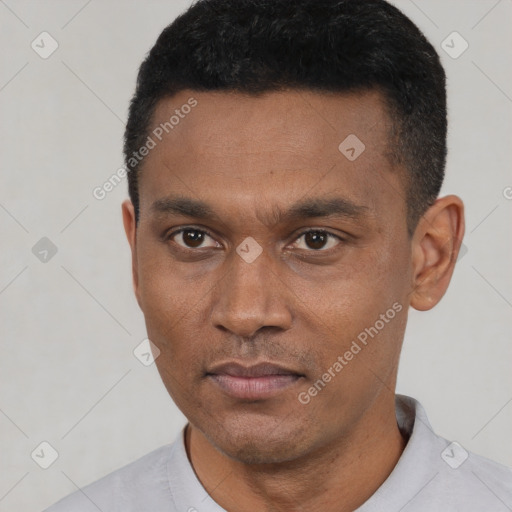 Neutral latino young-adult male with short  black hair and brown eyes