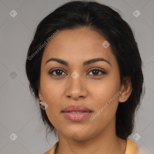 Joyful latino young-adult female with medium  brown hair and brown eyes