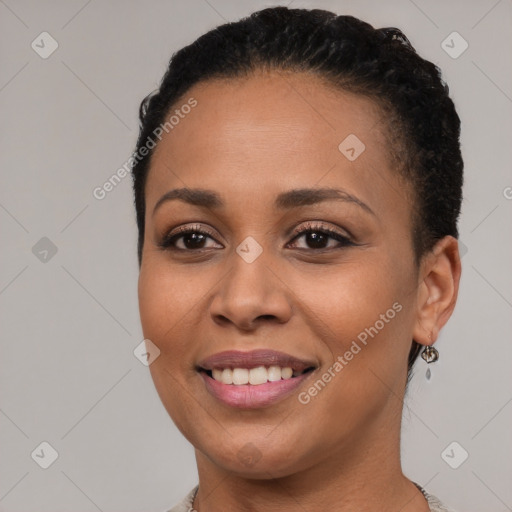 Joyful black young-adult female with short  brown hair and brown eyes