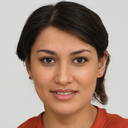 Joyful white young-adult female with medium  brown hair and brown eyes