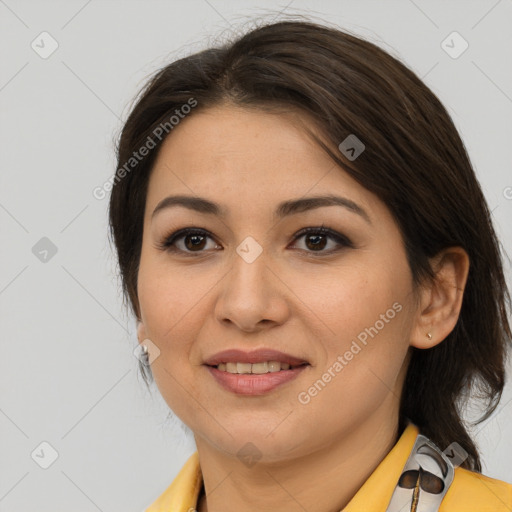 Joyful latino young-adult female with medium  brown hair and brown eyes