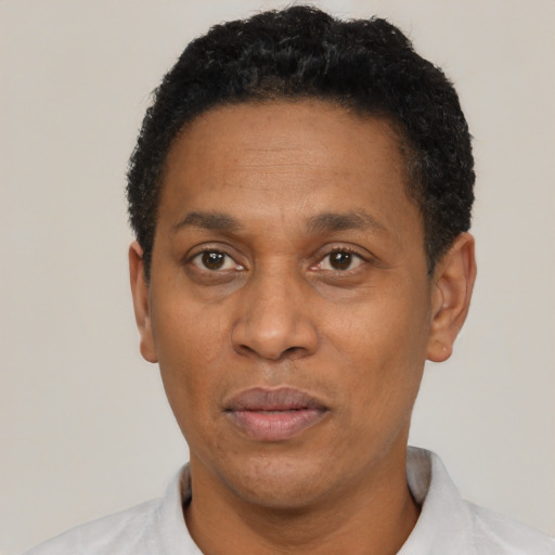 Neutral latino adult male with short  black hair and brown eyes
