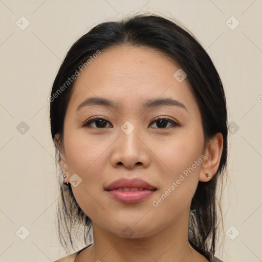 Joyful asian young-adult female with medium  black hair and brown eyes