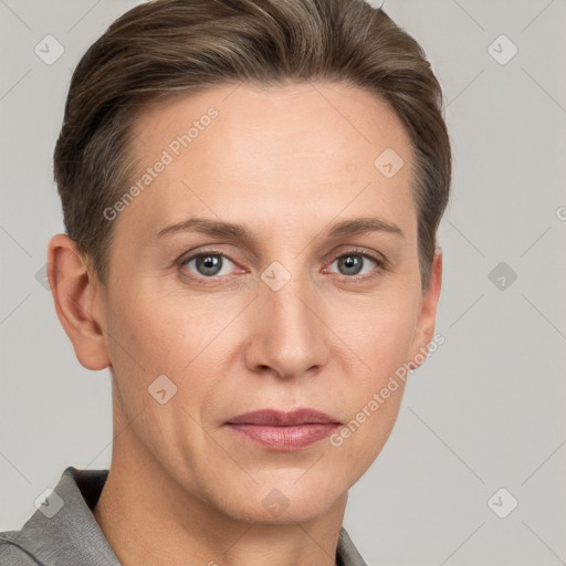 Joyful white adult female with short  brown hair and grey eyes