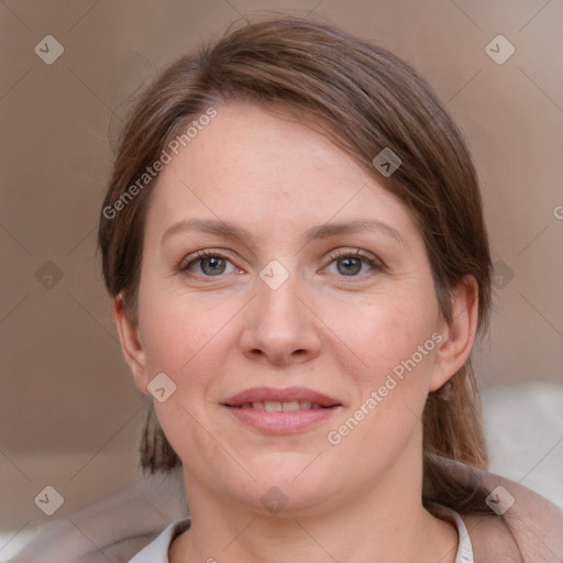 Joyful white young-adult female with medium  brown hair and blue eyes