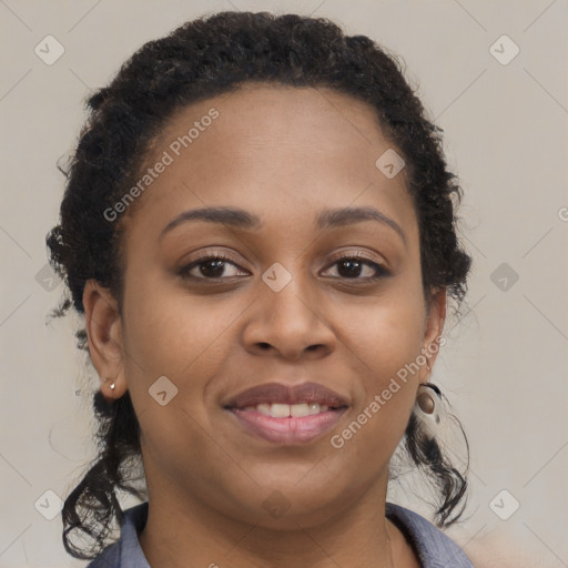 Joyful black young-adult female with long  brown hair and brown eyes