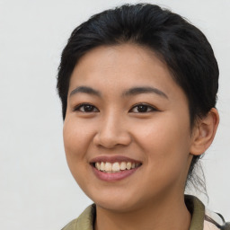 Joyful asian young-adult female with long  brown hair and brown eyes