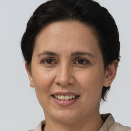 Joyful white adult female with short  brown hair and brown eyes