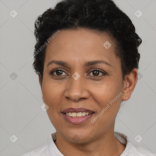 Joyful black adult female with short  black hair and brown eyes