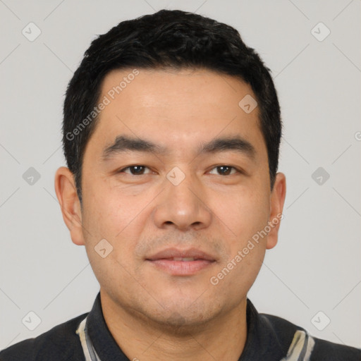 Joyful white young-adult male with short  black hair and brown eyes