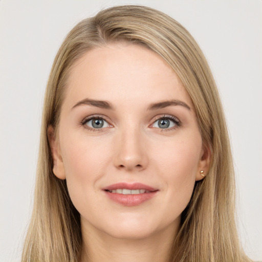 Joyful white young-adult female with long  brown hair and grey eyes