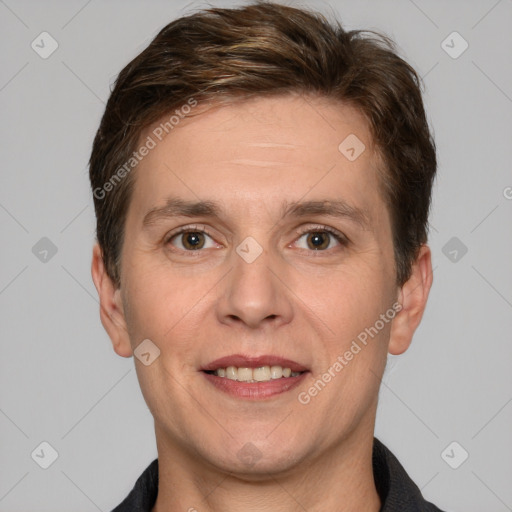 Joyful white adult male with short  brown hair and brown eyes