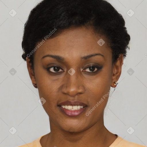 Joyful black young-adult female with short  black hair and brown eyes