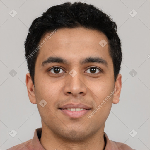 Joyful latino young-adult male with short  brown hair and brown eyes