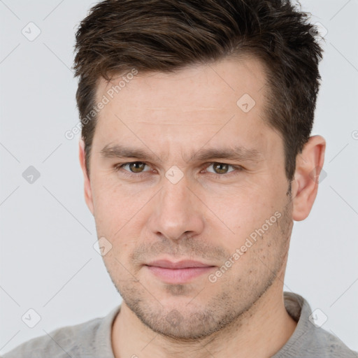 Neutral white adult male with short  brown hair and grey eyes