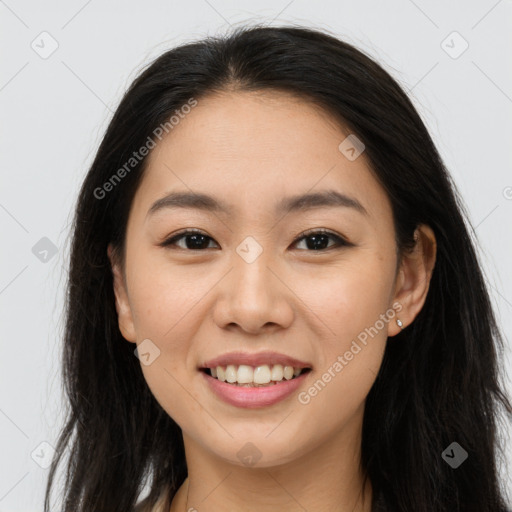 Joyful asian young-adult female with long  brown hair and brown eyes