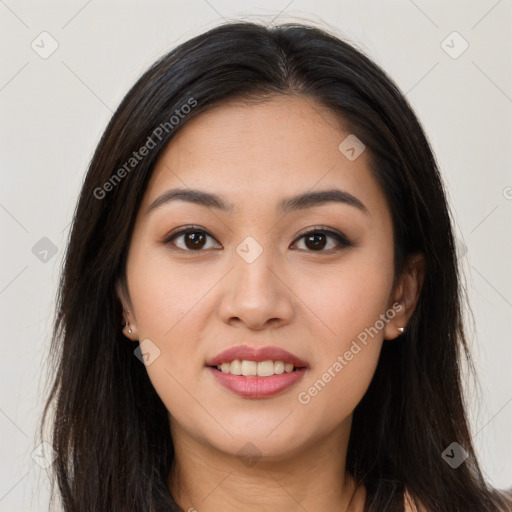 Joyful asian young-adult female with long  brown hair and brown eyes