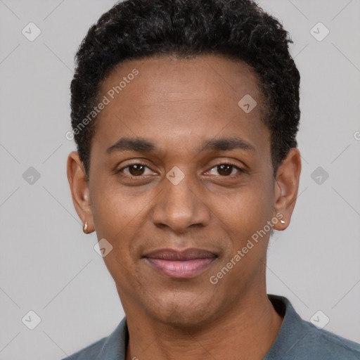 Joyful black young-adult male with short  black hair and brown eyes