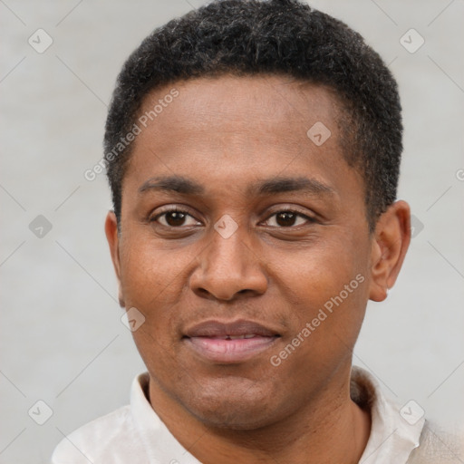 Joyful latino young-adult male with short  brown hair and brown eyes