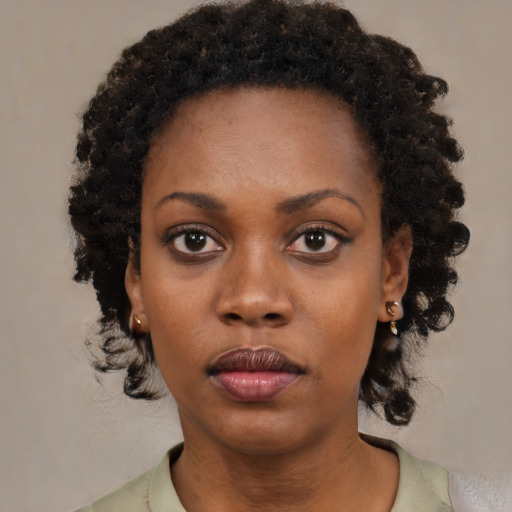Neutral black young-adult female with medium  black hair and brown eyes