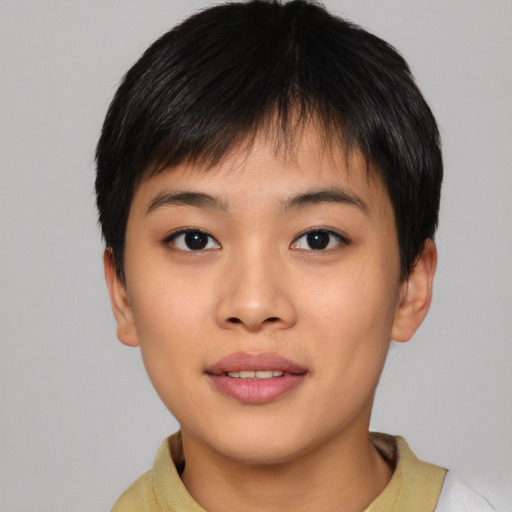 Joyful asian young-adult female with short  black hair and brown eyes